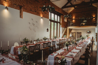 Elegant barn wedding reception setup with rustic decor.