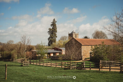 Rustic countryside church and fence in sunny setting at Dodfrod Manor.